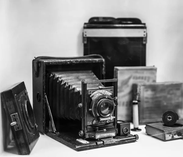 Folding bed plate medium format vintage film camera. Old bellows photo camera isolated on white background