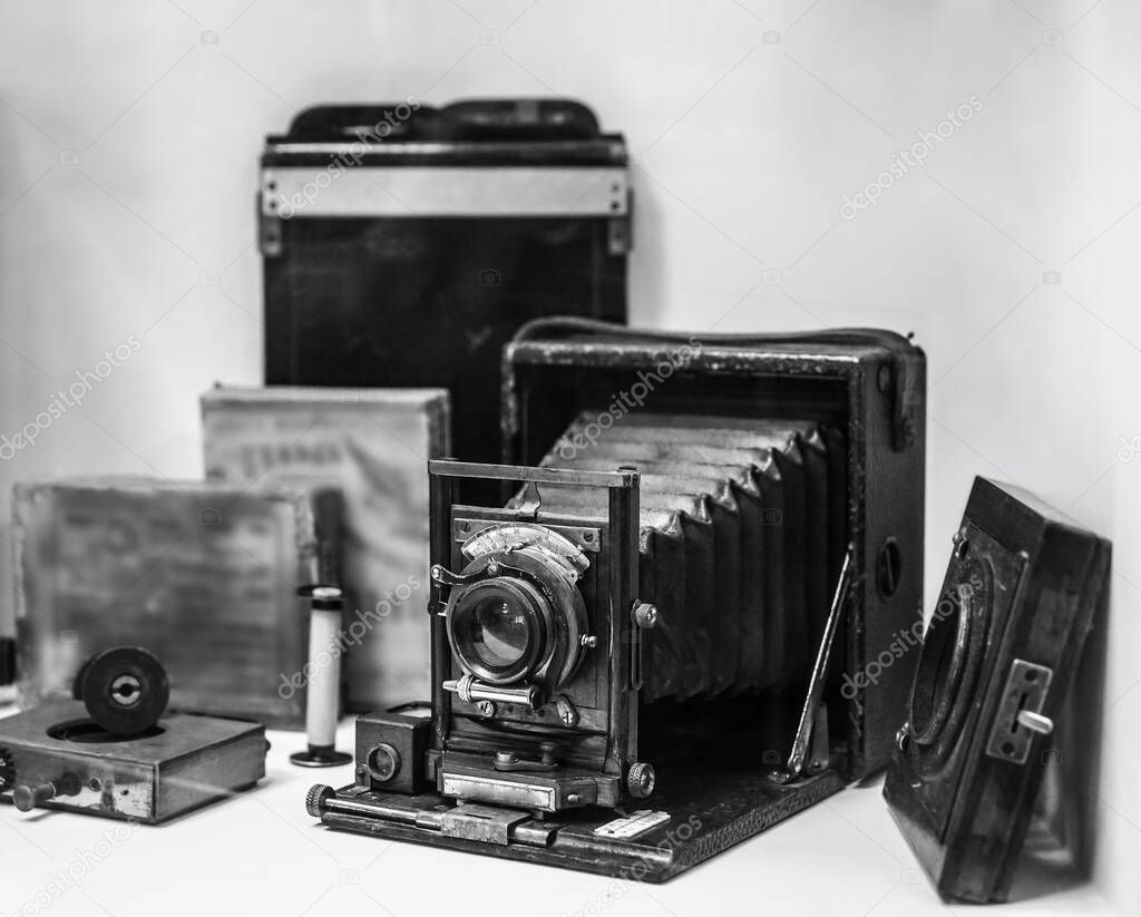 Folding bed plate medium format vintage film camera. Old bellows photo camera isolated on white background