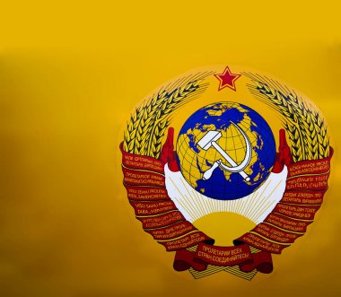 SSCB arması. Çekiç ve orakla komünizm simgesi. Sosyalizm sembollü kırmızı yıldız. Amblem. Sovyet Sosyalist Cumhuriyetler Birliği. Tüm ülkelerin proleterleri birleşin.