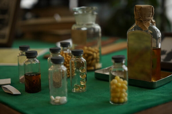 table with medicines in bottles, boxes. Medical background for business, pharmacies, clinics, hospitals.