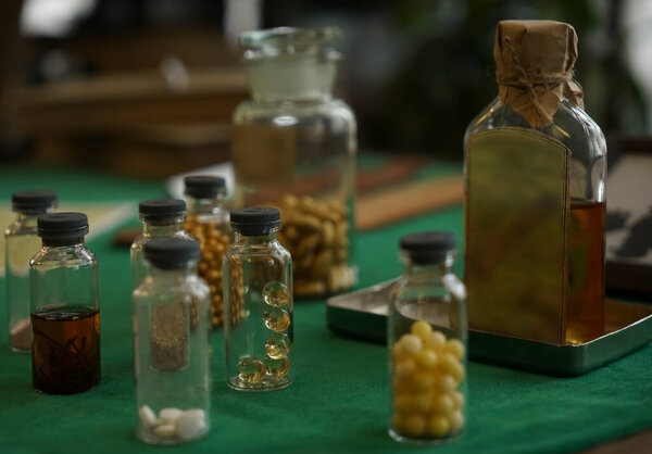 table with medicines in bottles, boxes. Medical background for business, pharmacies, clinics, hospitals.