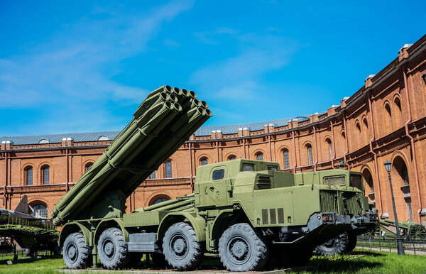 Weapons of mass destruction. A missile with a warhead looks into the sky, ready to launch. Nuclear weapons, chemical weapons. Bomb, shelling, Against the background of blue  sky 