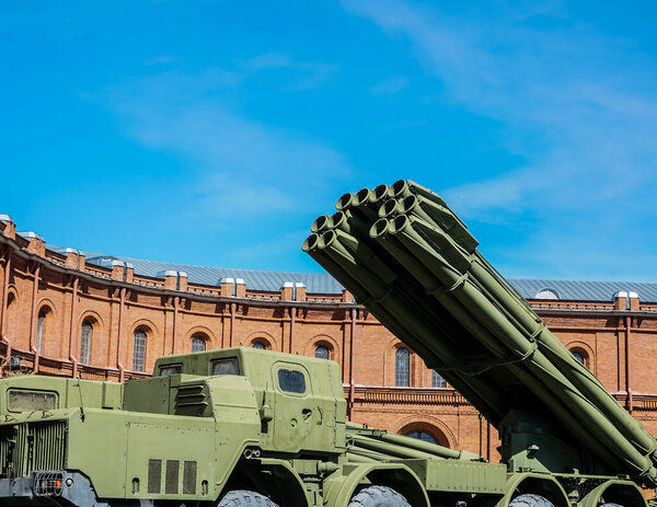 Weapons of mass destruction. A missile with a warhead looks into the sky, ready to launch. Nuclear weapons, chemical weapons. Bomb, shelling, Against the background of blue  sky 