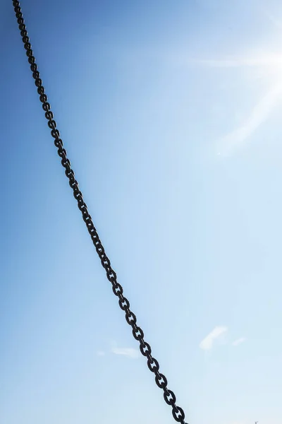 Metal Chain Hanging Blue Sunny Sky Background — Stock Photo, Image