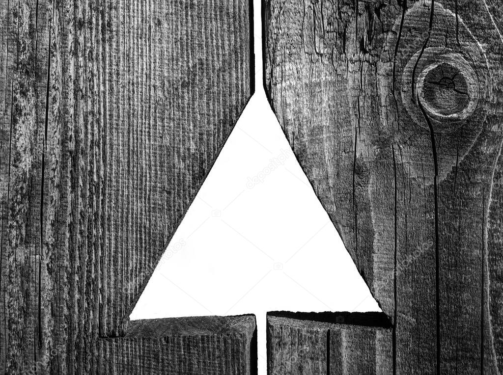 Wall  of wooden panel with one  triangular hole
