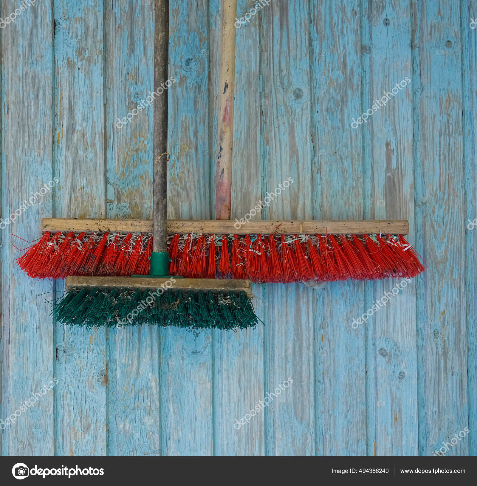 https://st2.depositphotos.com/5647624/49438/i/1600/depositphotos_494386240-stock-photo-two-dusty-brooms-long-wooden.jpg