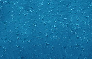 Buz dokusu arka planı. Buz tabakasının desenli soğuk yüzeyi 