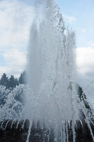 The gush of water of a fountain. Splash of water in the fountain, abstract image.