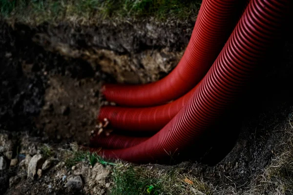 close up of corrugated pipes in the ground