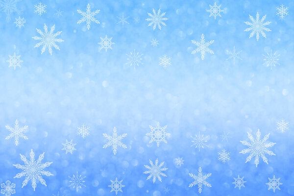 Дефокусируйте синий фон на боке и снежинках. Рождество, Новый год. Копирование пространства.