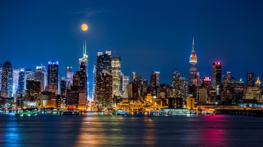 Super Moon above New York skyline. clipart