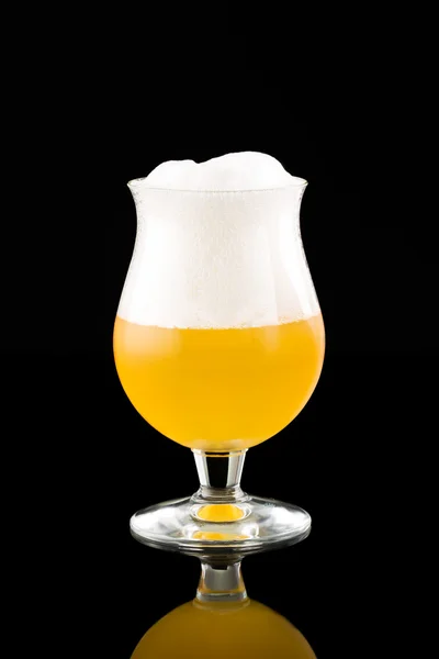 Glass with beer on a black — Stock Photo, Image