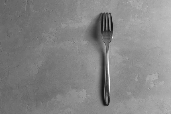 Fork on the concrete background — Stock Photo, Image