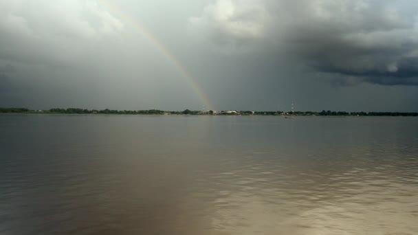 Rainbow over the river ( shot from a boat) — Stock Video