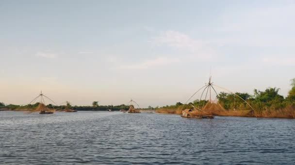 Houseboats with chinese fishing nets on a lake — Stock Video