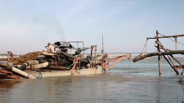 Dredging boat on river pumping riverbed sand — Stock Video