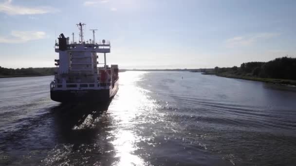 Sunlight Reflection River Water Surface Container Ship Travelling Summer Aerial — Stock Video