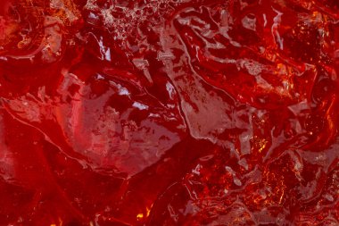 Kırmızı çilekli jelatin jöle yapısı, soyut mutfak kırmızı dokusu, kapat.