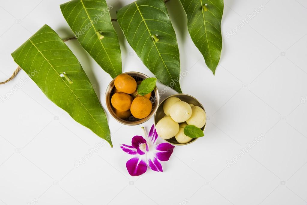 Garland Of Mango Leaves With Indian Sweet Pedha And Orchid