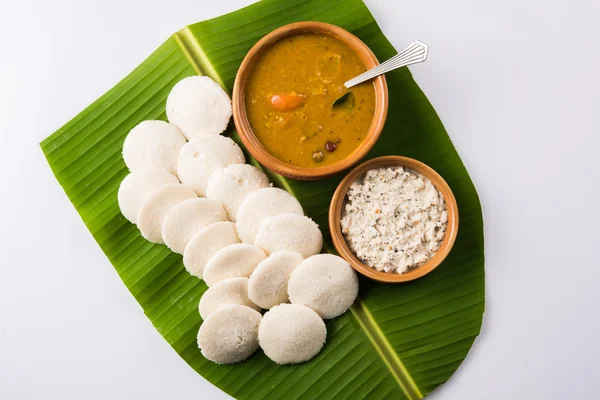 Premium Photo  Idly or idli south indian main breakfast item which is  beautifully arranged in a black plate on white background