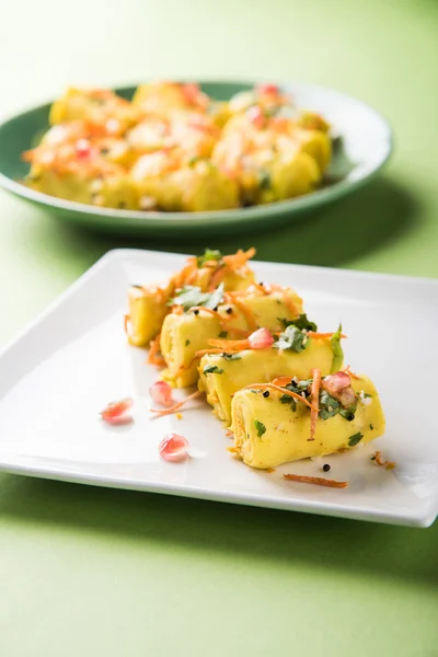 khandvi is a gujarati snack from India which is made with gram flour and curds tempered with sesame seeds and mustard seeds also known as Surali chya Vadya/Stuffed Khandvi, selective focus