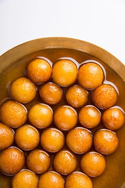 Gulab jamun, or gulaab jamun, is a milk-solids-based sweet mithai — Stock Photo, Image