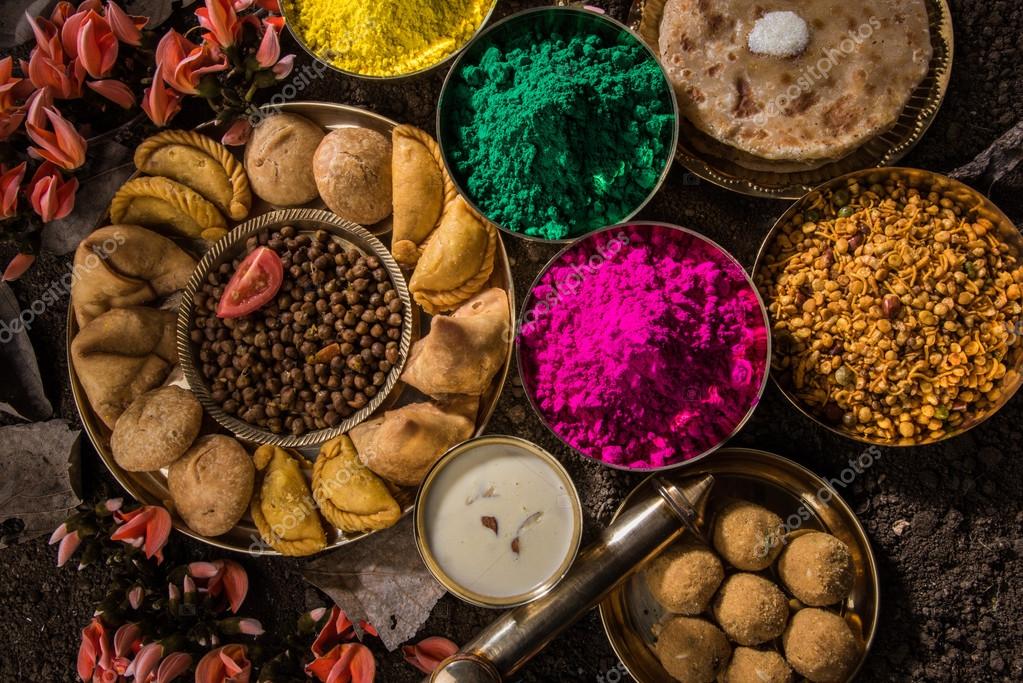 Holi the Origin,Story Fall of Tyrant,Tale of Love & Colour 8 Holi festival food with colours, indian festival holi, samosa, kachori, laddu, gujiya, palash flower, thandai, farsan, puran poli or roti, indian festival of colours called holi ⬇ Stock Photo, Image by ©