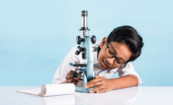 indian boy and microscope, asian boy with microscope, Cute little kid holding microscope, 10 year old indian boy and science experiment, boy doing science experiments