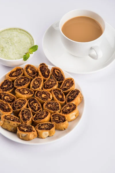 Indian spicy sweet fried snack also known as bakarwadi or bakarvadi or bakar vadi or bakar wadi or spring roll, favourite snacks with tea,  favourite snacks item originated in pune, maharashtra — Stock Photo, Image