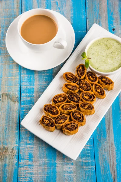 Indian spicy sweet fried snack also known as bakarwadi or bakarvadi or bakar vadi or bakar wadi or spring roll, favourite snacks with tea,  favourite snacks item originated in pune, maharashtra — Stock Photo, Image