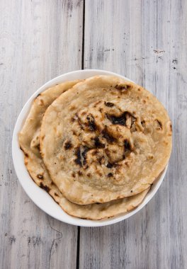 tereyağı roti, chapati, naan, kulcha, paratha, tanduri roti olarak da bilinen hint özel ekmek