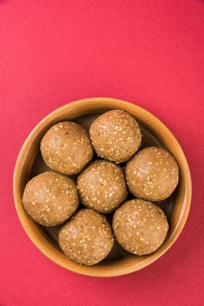 indian sesame sweet or tilgul laddu, made up of jaggery and sesame seeds, hand made, round, indian sweet prepared in Makar Sankranti festival