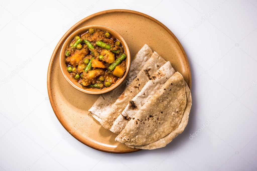 Indian recipe, mixed veg containing potato and beans with traditional ...