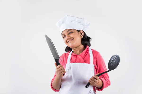 Small girl chef, small girl cook, asian small girl in chef uniform, Indian girl in chef attire, cooking and people concept - smiling little girl in cook hat — Stock Photo, Image