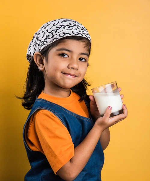 4 year old indian girl with a glass full of plain white milk, indian girl and plain milk, indian girl drinking milk, asian girl and milk glass, portrait, brown skin, indian baby girl