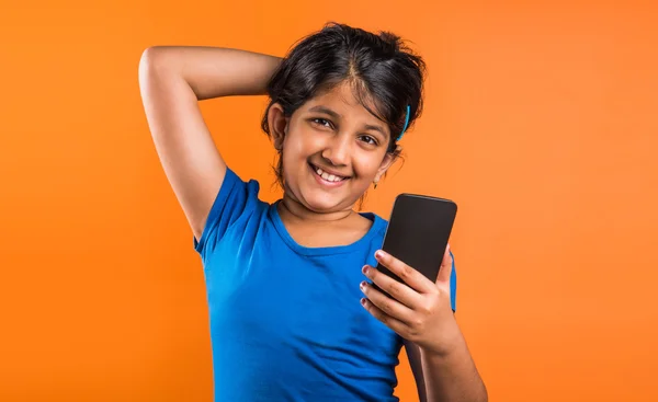 indian small girl with mobile, asian small girl with mobile, indian girl child and mobile, asian girl clild and mobile, indian small girl posing with mobile, indian girl playing with mobile, selfie