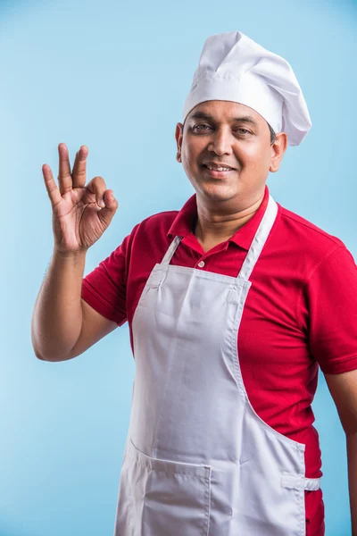 Portrait of a smiling indian male chef cook showing ok sign isolated on a white background, asian male chef and ok sign — Stock Photo, Image