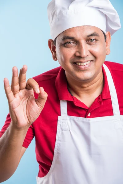 Portrait of a smiling indian male chef cook showing ok sign isolated on a white background, asian male chef and ok sign — Stock Photo, Image