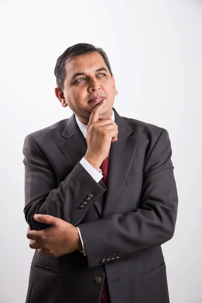 Indian mid age businessman thinking, handsome asian businessman thinking, indian businessman with one hand folded and one hand touching chin, thinking, isolated over white background — Stock Photo, Image