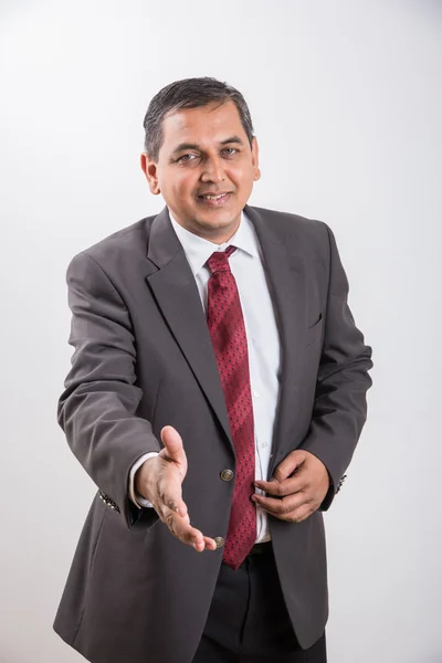 Smiling Indian businessman outstretching hand for a handshake, Asian businessman offering hand shake or shake hand or shakehand — Fotografia de Stock