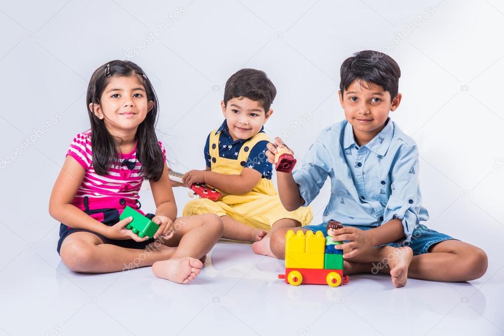 Indian kids playing with block toys — Stock Photo © stockimagefactory