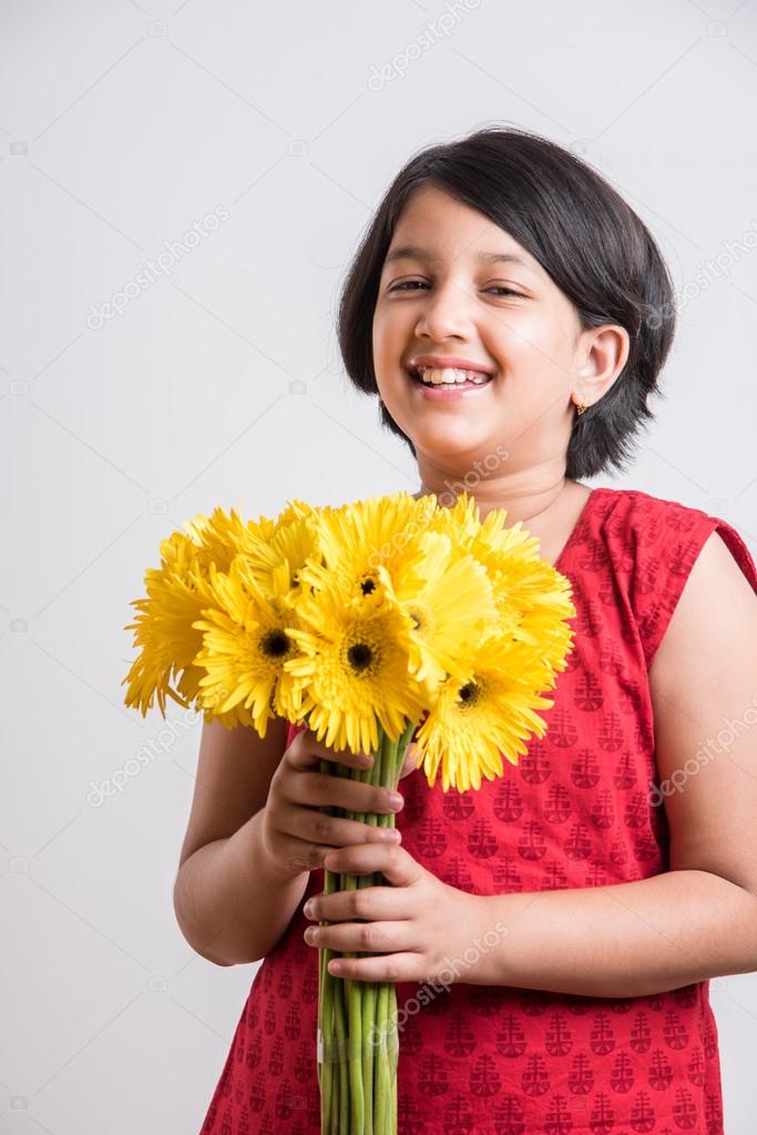 Indian Small Girl Holding Bouquet Of Yellow Gerbera Flowers Isolated Over White Background Indian Girl And Flowers Asian Girk Holding Flowers Stock Photo Image By C Stockimagefactory Com 115398120