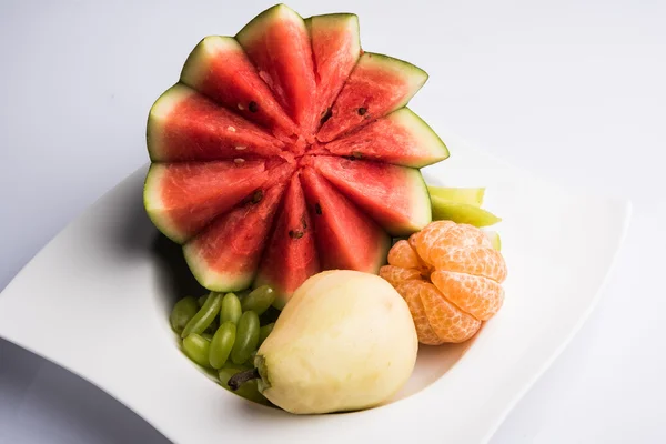 fruit salad or cut fruits, Diet, healthy fruit salad in the white bowl - healthy breakfast, weight loss concept, Fruit plate, Diet fruit salad in white plate, closeup