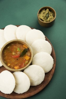 Idly with sambar Iddli is a traditional breakfast of South Indian clipart