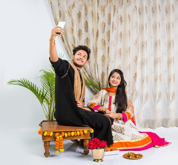 Indian sister taking selfie with brother on Raksha Bandhan festival after tying knot or rakhi — Stock Photo, Image