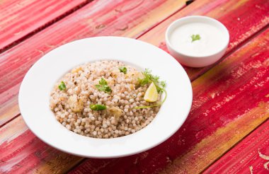 Sabudana Khichadi - An authentic dish from Maharashtra made with sago seeds, served with curd clipart