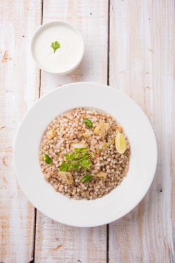 Sabudana Khichadi - An authentic dish from Maharashtra made with sago seeds, served with curd clipart