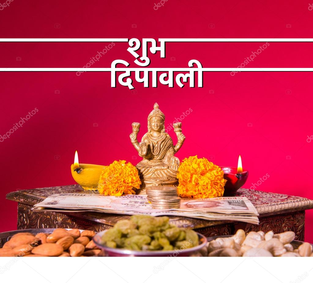 Happy Diwali Greeting card showing oil lamp or diya with crackers, sweet or mithai, dry fruits, indian currency notes, marigold flower and statue of Goddess Laxmi or Lakshmi on diwali night