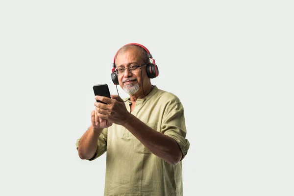 Happy Senior Indian Asian Bearded Man Smiling Using Headphones Smartphone — Stock Photo, Image