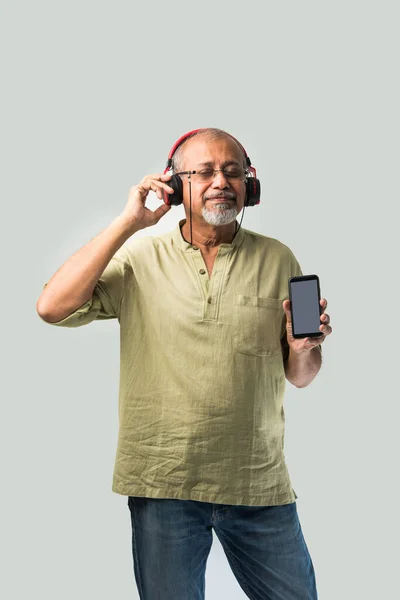Happy Senior Indian Asian Bearded Man Smiling Using Headphones Smartphone — Stock Photo, Image